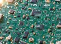 PCB背景上标注NTC、TVS、MOV、MOSFET、MCU等电子元器件英文缩写