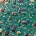 PCB背景上标注NTC、TVS、MOV、MOSFET、MCU等电子元器件英文缩写